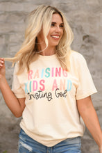 Load image into Gallery viewer, Raising Kids And Trusting God Tee